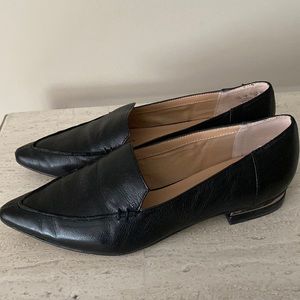 Franco Sarto black leather flats with metallic trim on heels . Size 8